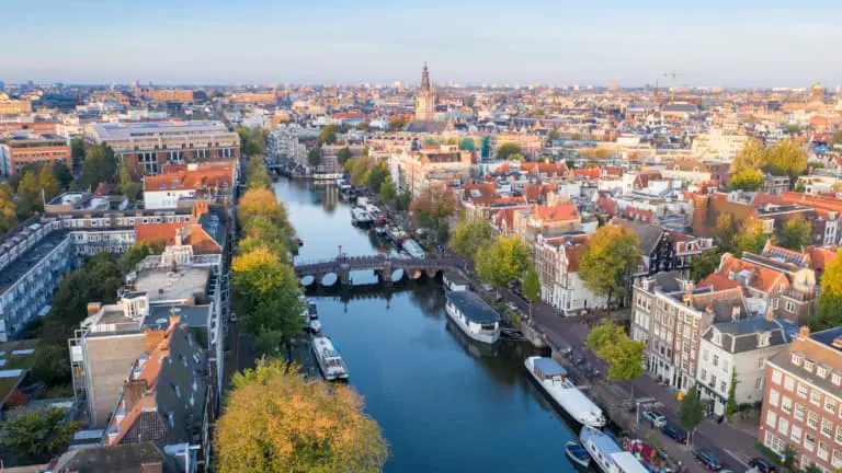 Aerial view of Amsterdam city centre with its beautiful Dutch houses and iconic canals