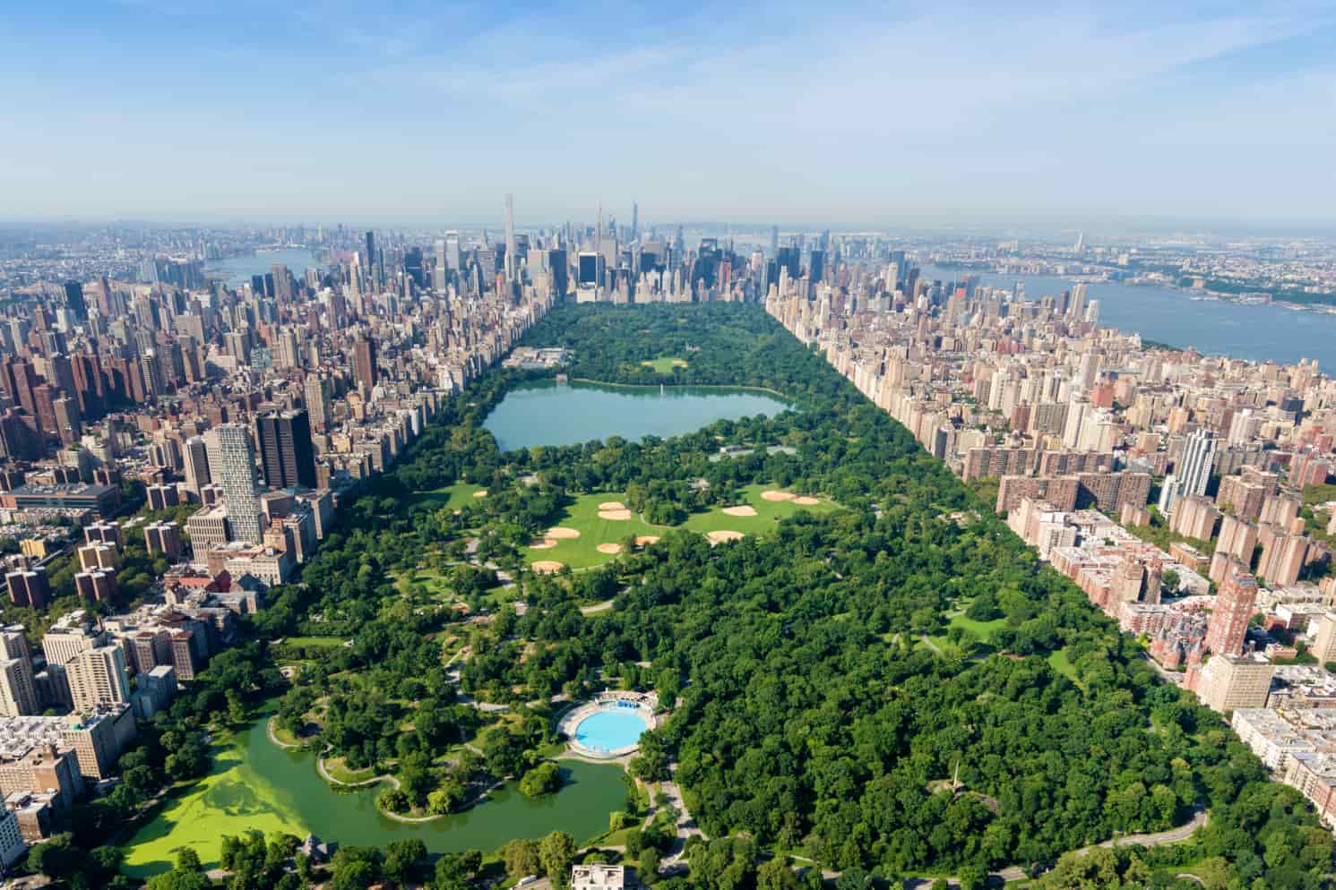 Aerial view of Central Park surrounded by the high-rise buildings of Manhattan, New York City