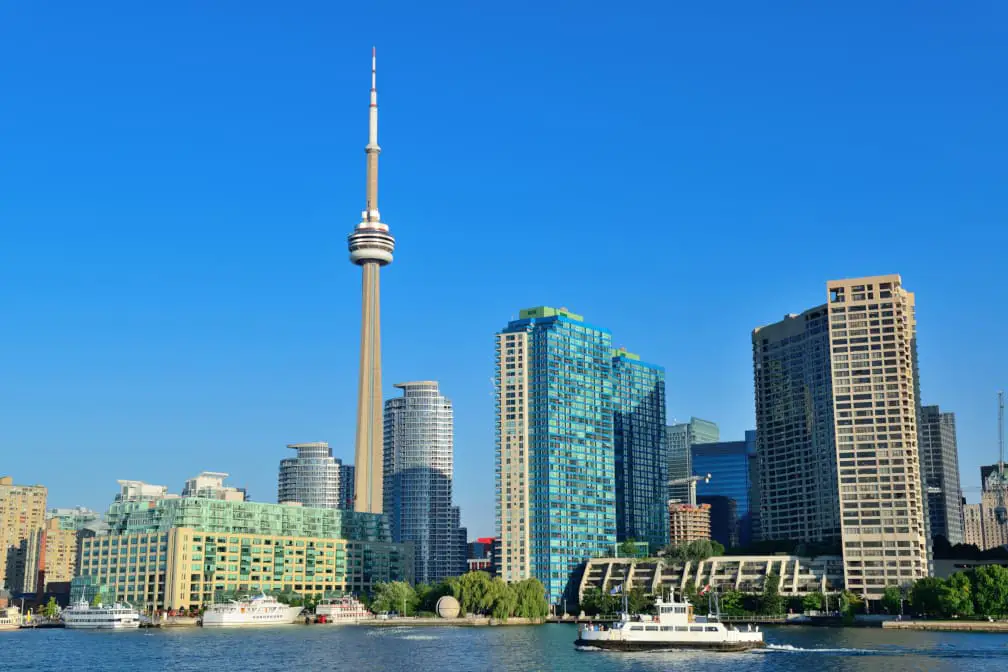 Skyline of Toronto's downtown Harbourfront neighbourhood along the shore of Lake Ontario, dominated by the imposing CN Tower