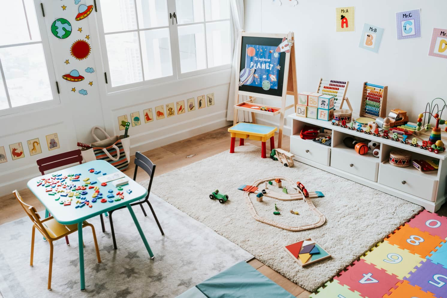 Colorful kindergarten classroom with posters of the English alphabet on the walls