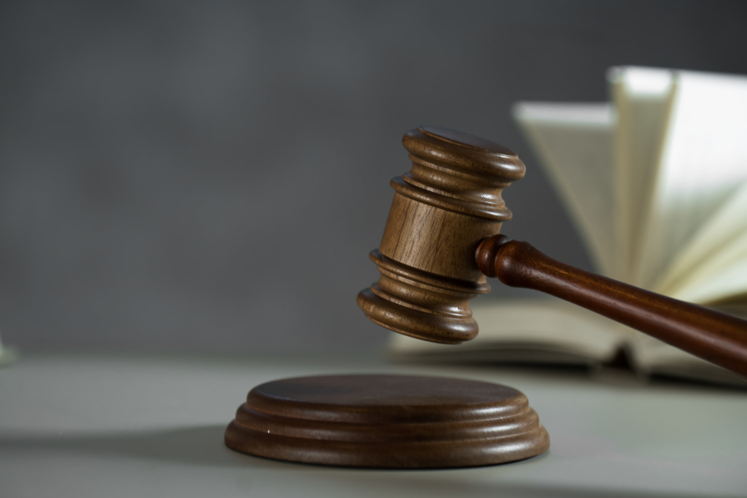 Close-up of wooden gavel in striking motion