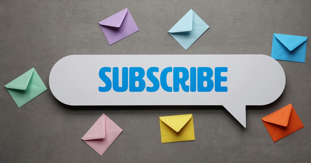 The word "subscribe" written on a speech bubble surrounded by colorful paper envelopes